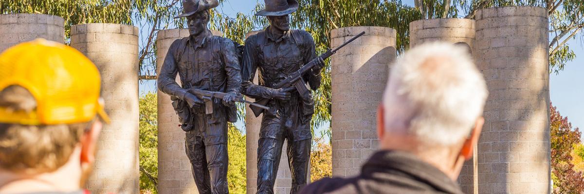 An image of people looking at the Australian Army National Memorial at Anzac Parade, Canberra