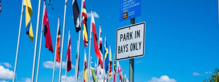 Parking signage next to the International Flag Display, Parkes.