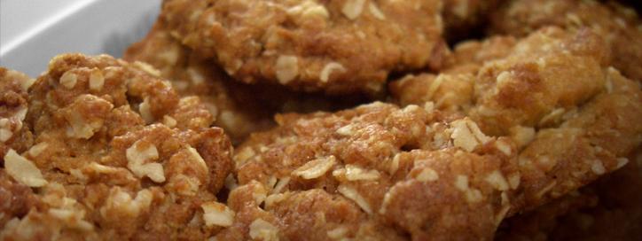 A plate of freshly baked, golden ANZAC Biscuits