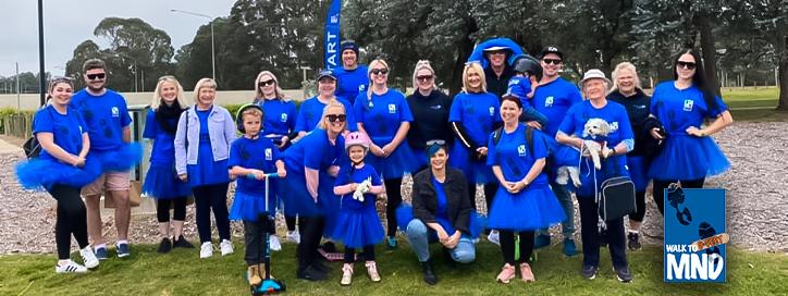 Group of participants in Walk to d'Feet MND dressed in blue tutus and t-shirts