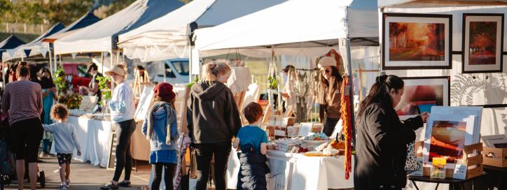 People strolling through market stalls