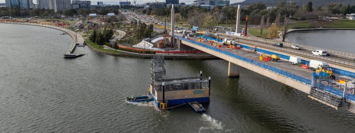 This image is an aerial short looking towards the northern end of Commonwealth Avenue Bridge. A barge is in the water moving further north as we set up for the Pier 4 bearing replacement.