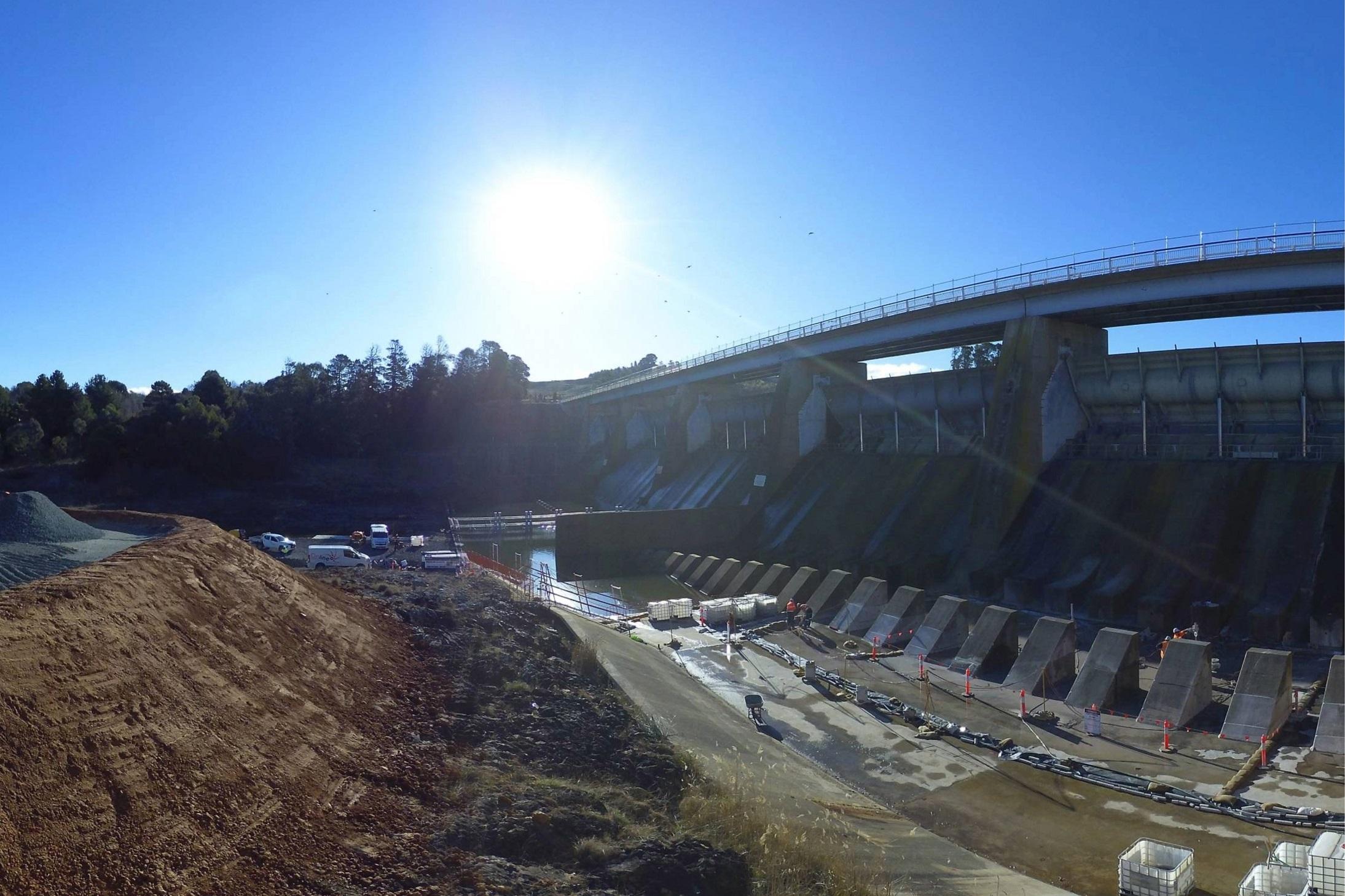This image is from a timelapse camera showing the dam empty and preparation for removal of the baffle blocks.