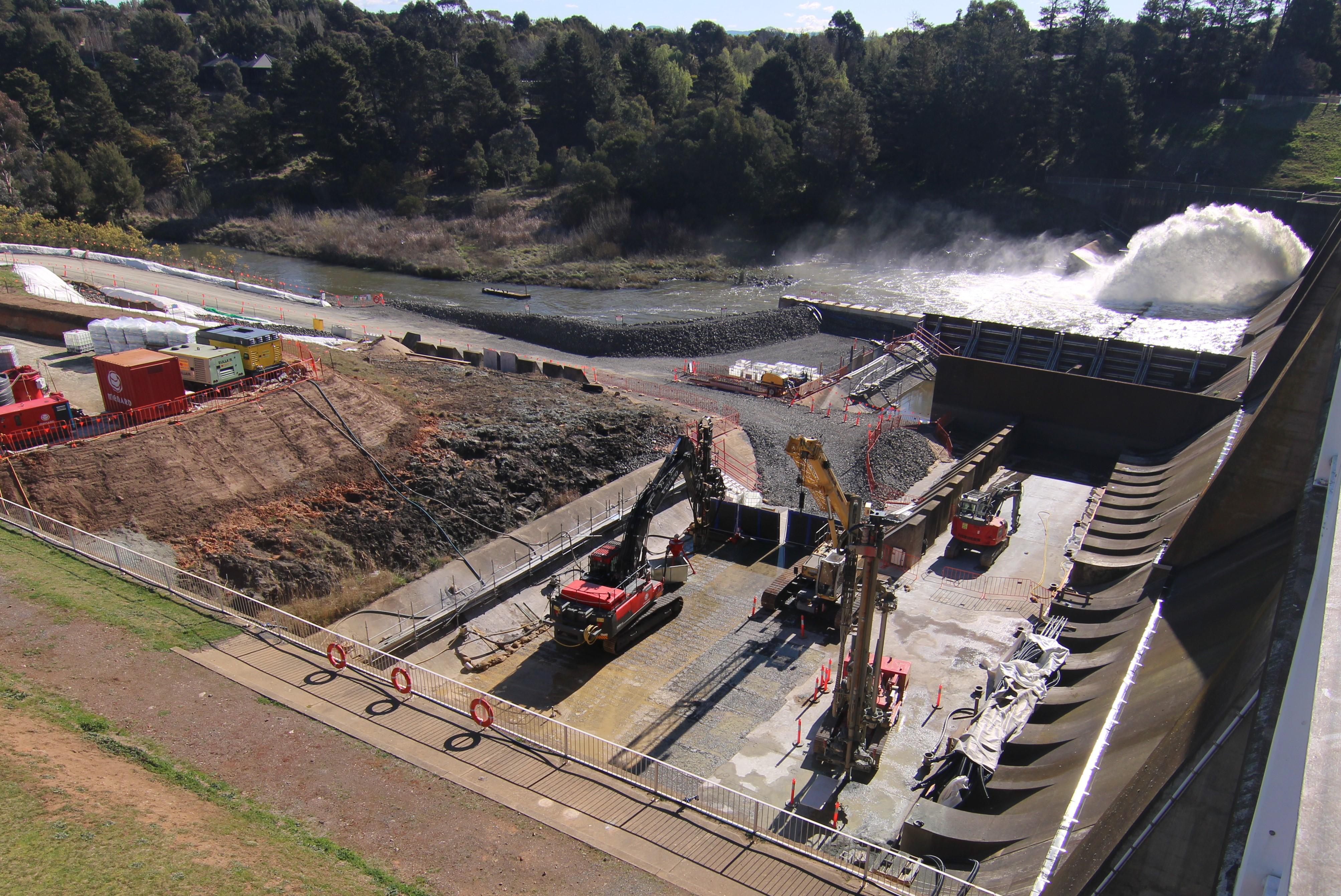 This image is taking from the timelapse camera showing a water release occurring during the day and anchor drilling activities occurring on site