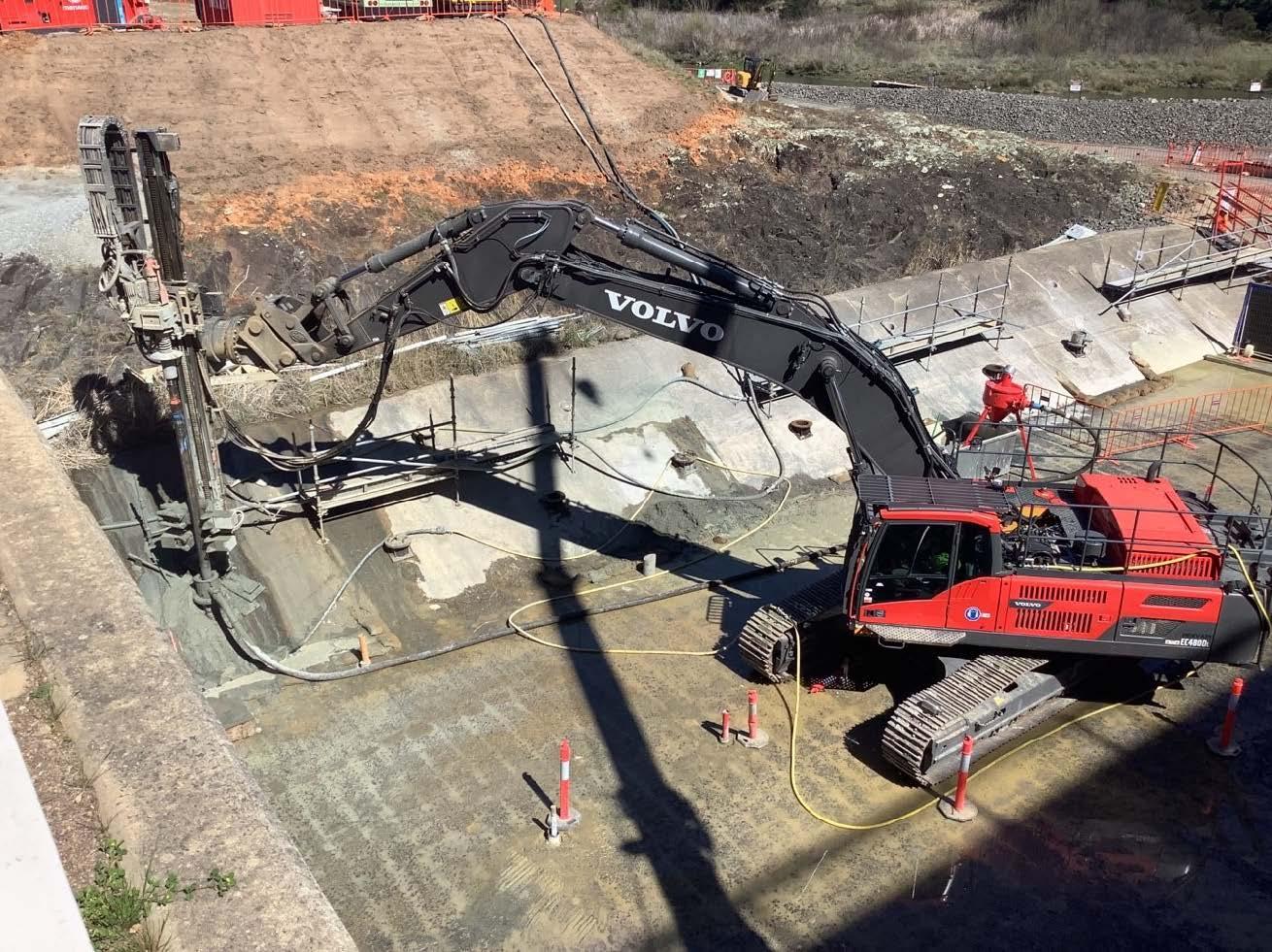 This image shows the excavator drilling rig in action on site