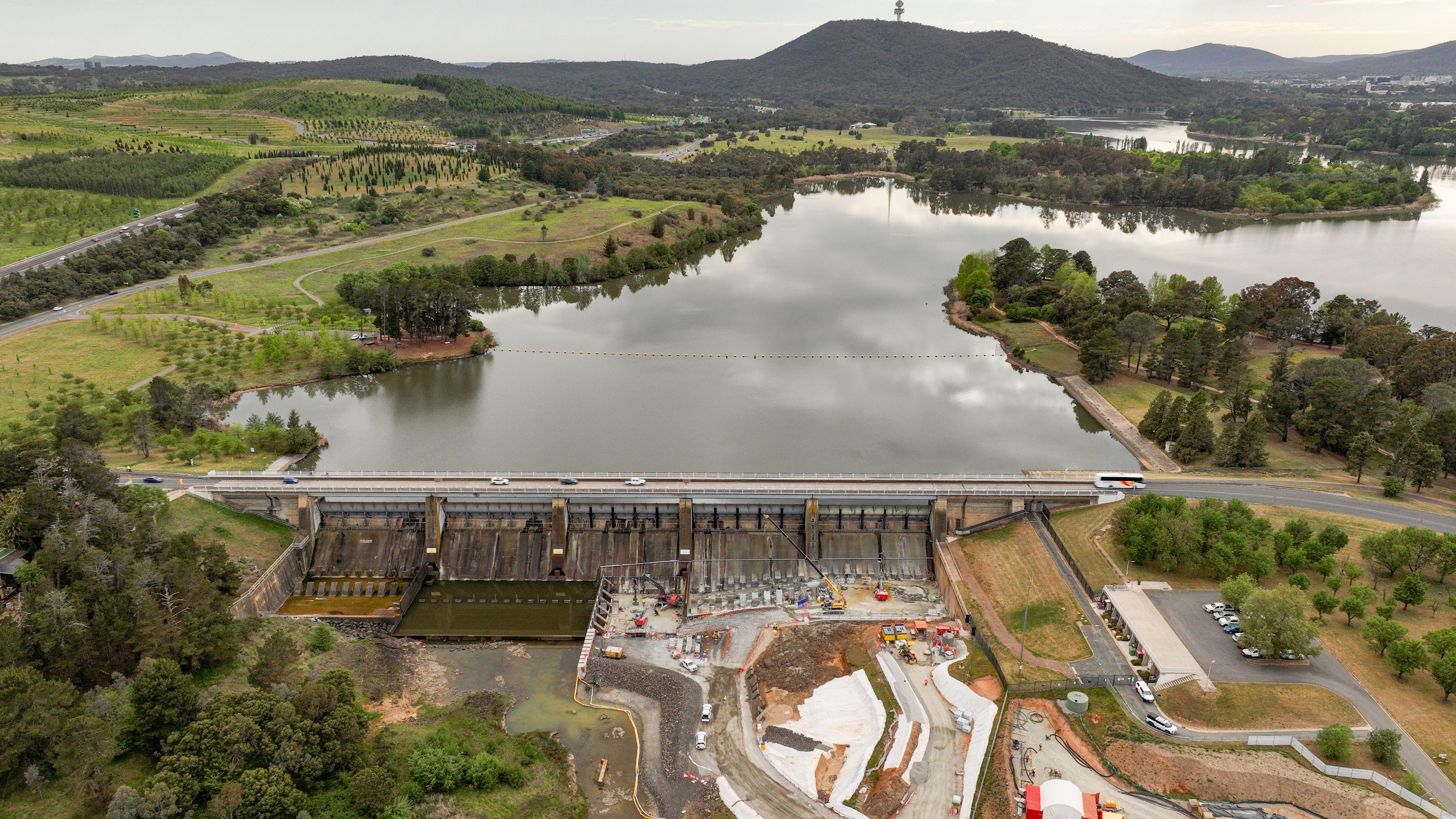 Drone shot taken of Scrivener Dam with Lake Burley Griffin and Telstra Tower in the background