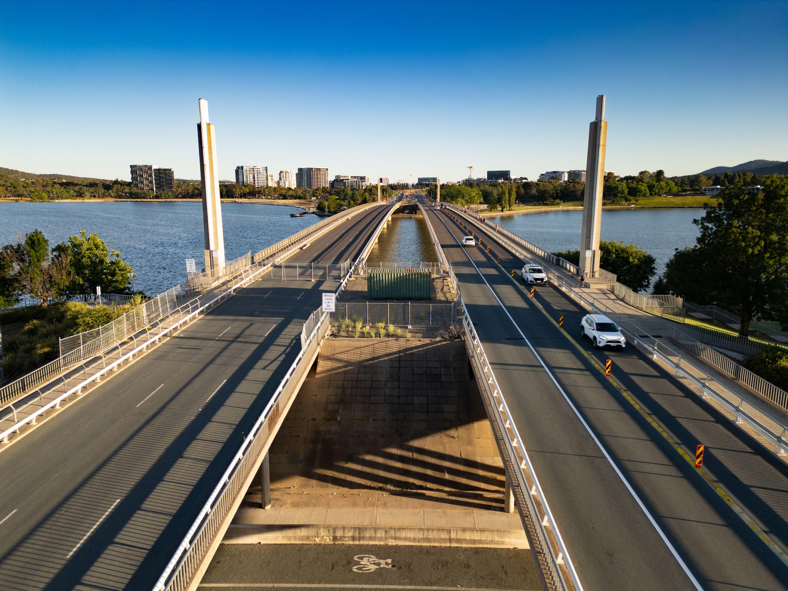 This image is of Commonwealth Avenue Bridge taken from the southern end of the bridge showing one side closed and one side operating two directions of traffic.