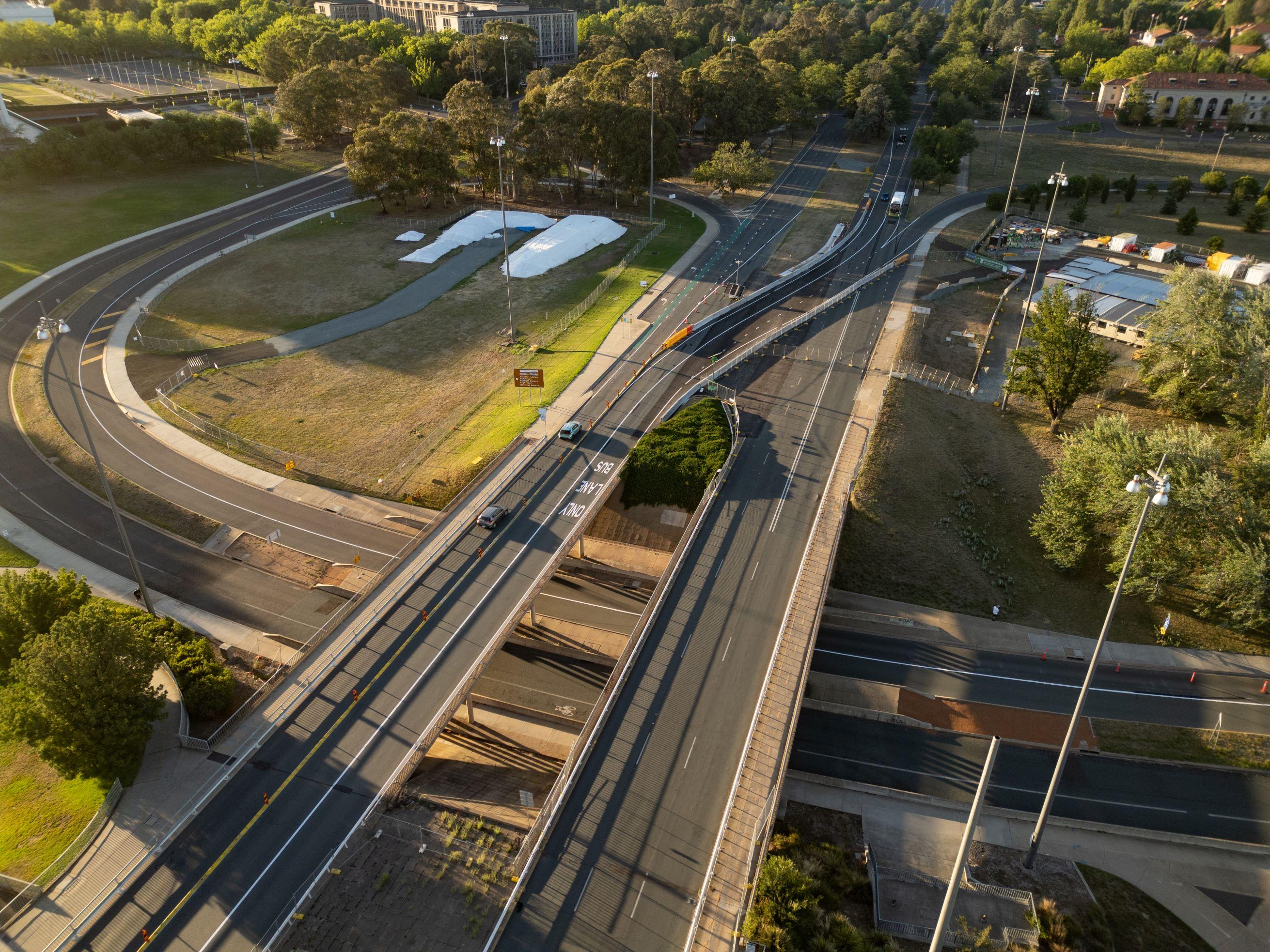 This image is a drone photo of the southern end of Commonwealth Avenue Bridge showing traffic crossing over from north to south.