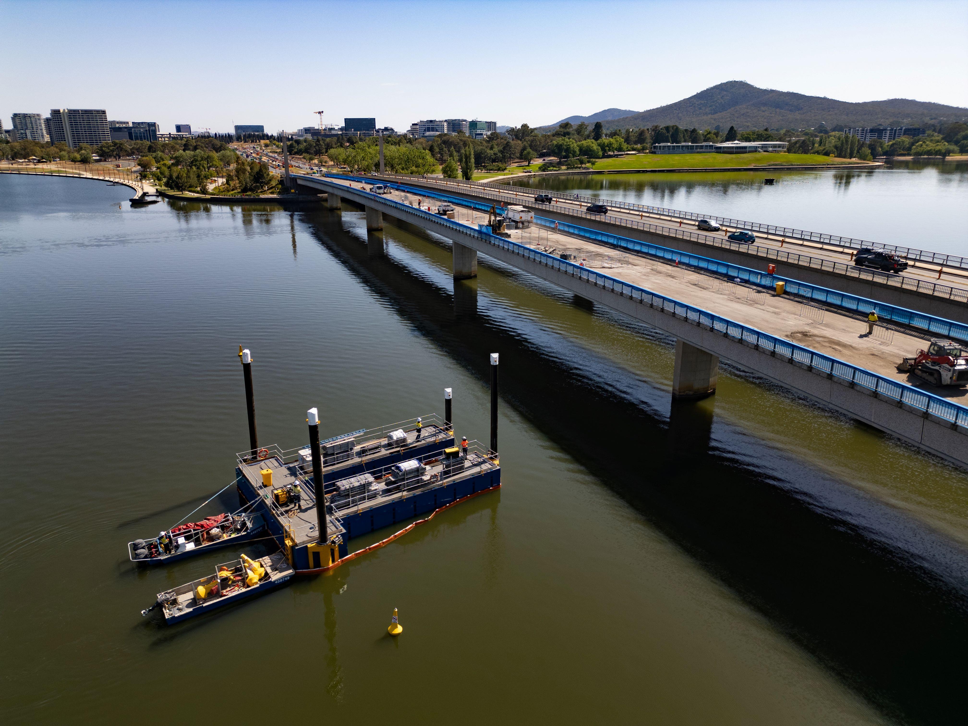 Works beneath the bridge will be carried out from barges and across three days at the end of January these were deliver to site, craned into the water, put together and moved to the first bridge pier at the southern end. 