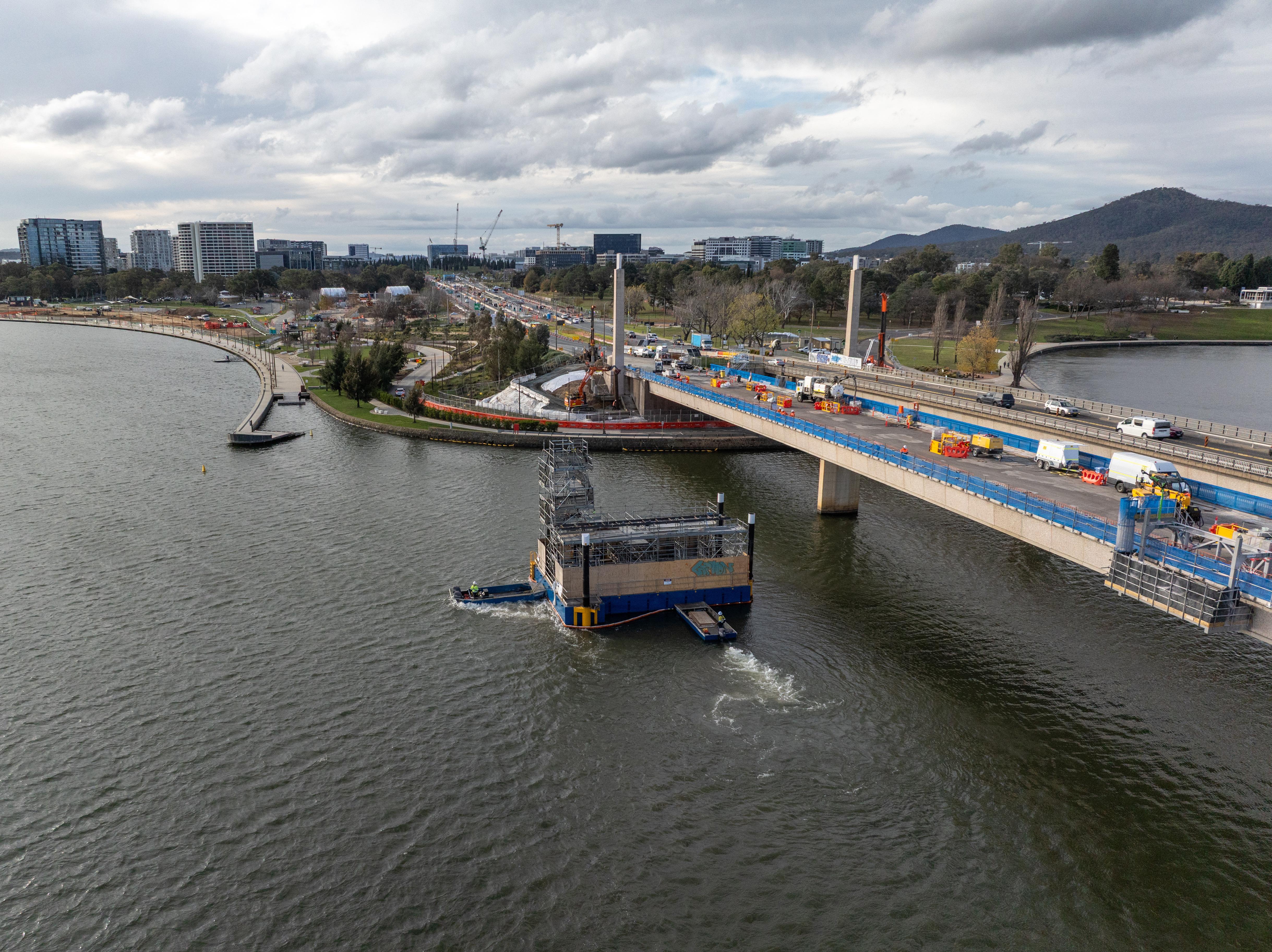 This image is an aerial short looking towards the northern end of Commonwealth Avenue Bridge. A barge is in the water moving further north as we set up for the Pier 4 bearing replacement.