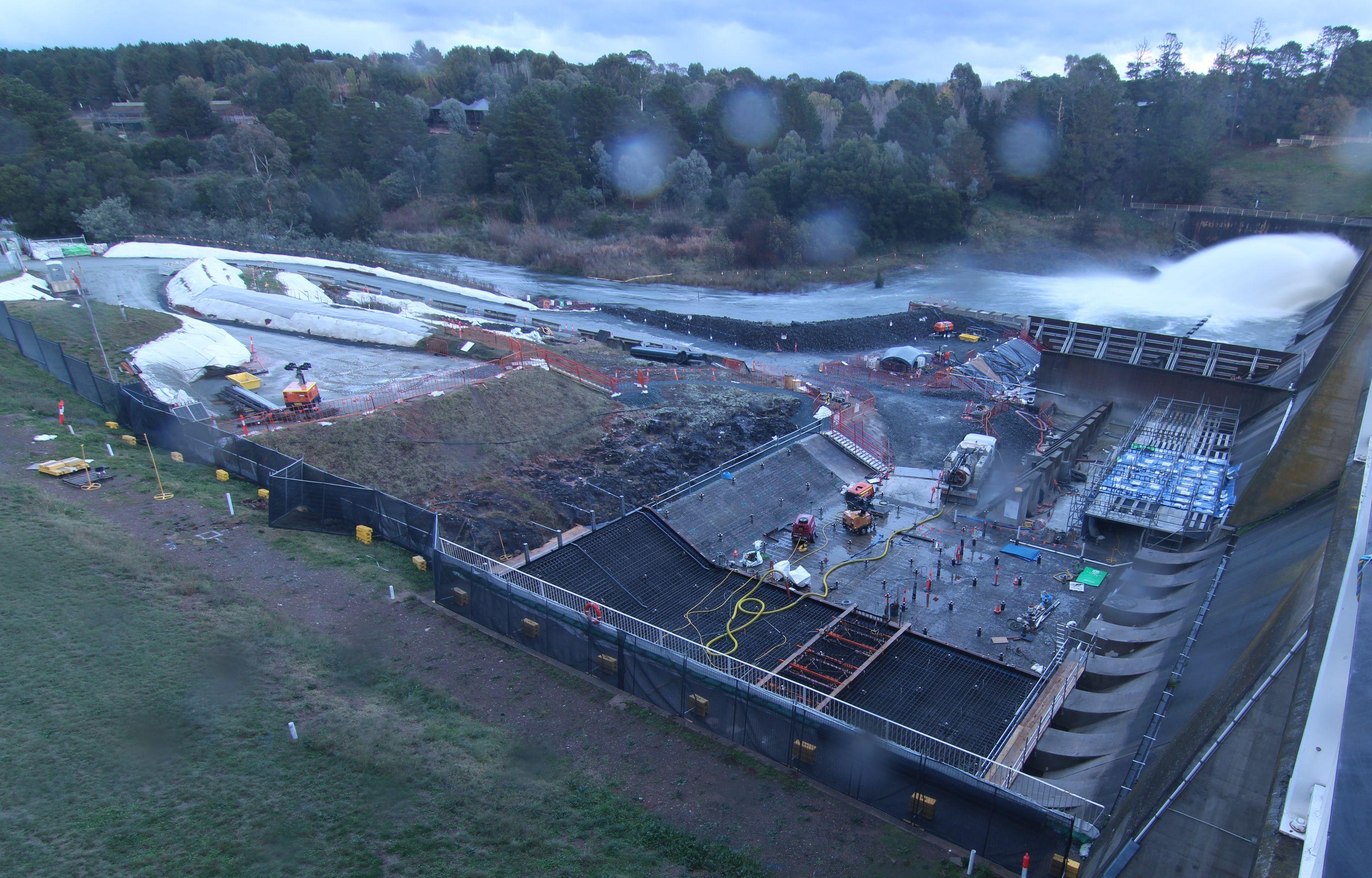 This image shows a water release happening on site whilst site preparation is underway the day of the second major concrete pour.