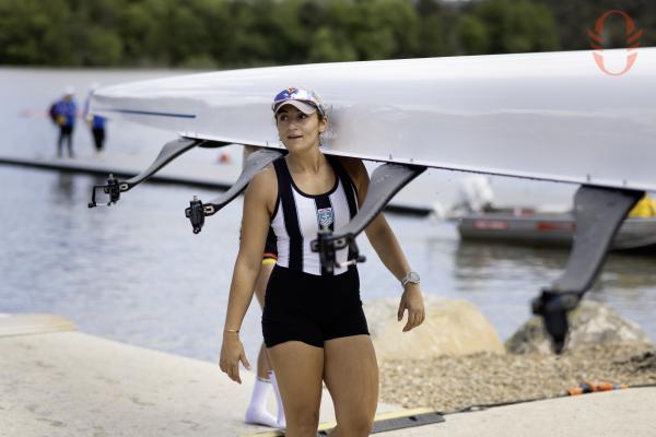 A person holding up a rowboat