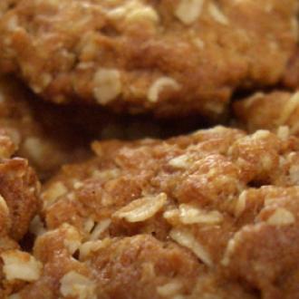 A plate of freshly baked, golden ANZAC Biscuits