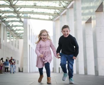 Kids joyfully running toward the camera