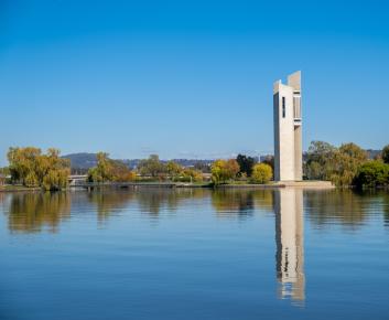 An image of the National Carillon reflected in the waters of Lake Burley Griffin